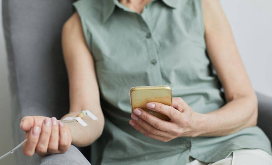 Patient receiving an IV treatment at home.